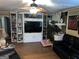 Cozy living room featuring custom built-ins and a stone fireplace at 520 Mcdonough Rd, Hampton, GA 30228
