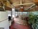 Cozy sunroom featuring a dining table, wood flooring, and a vibrant floral rug at 520 Mcdonough Rd, Hampton, GA 30228