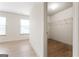 Sunlit bedroom with hardwood flooring and a view into a walk-in closet at 2714 Haynescrest Dr, Grayson, GA 30017