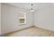 Bright bedroom with hardwood floors, light neutral walls, and a window at 2714 Haynescrest Dr, Grayson, GA 30017
