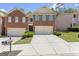 Charming brick townhome featuring a two-car garage and well-maintained landscaping at 2714 Haynescrest Dr, Grayson, GA 30017