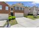 Inviting townhome with brick facade, two-car garage and lush green lawn at 2714 Haynescrest Dr, Grayson, GA 30017