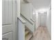 Bright hallway featuring hardwood floors, staircase and modern chandelier at 2714 Haynescrest Dr, Grayson, GA 30017