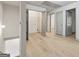 Bright hallway featuring hardwood floors and access to a utility closet at 2714 Haynescrest Dr, Grayson, GA 30017