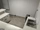 Basement bar with white cabinets, sink, laminate countertop and plank flooring at 7640 Ryefield Dr, Sandy Springs, GA 30350