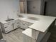 Finished basement bar with ample counter space and white cabinets at 7640 Ryefield Dr, Sandy Springs, GA 30350