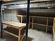 Unfinished basement with storage shelves and exposed ceiling at 7640 Ryefield Dr, Sandy Springs, GA 30350