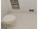 Close up of a toilet on a white tiled floor in a well lit room at 7640 Ryefield Dr, Sandy Springs, GA 30350