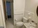Bright bathroom with a new toilet, tiled walls, and granite countertop at 7640 Ryefield Dr, Sandy Springs, GA 30350