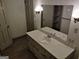 Well-lit bathroom featuring a large mirror and a single vanity with a white countertop at 7640 Ryefield Dr, Sandy Springs, GA 30350