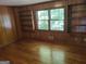 Bedroom with wood paneling and hardwood floors at 7640 Ryefield Dr, Sandy Springs, GA 30350