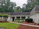Charming entrance featuring manicured hedges and a walkway leading to the front door at 7640 Ryefield Dr, Sandy Springs, GA 30350