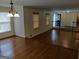 Bright and inviting living room with hardwood floors and classic architectural details at 7640 Ryefield Dr, Sandy Springs, GA 30350