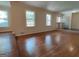 Large living room with shiny hardwood floors, large windows and white trim at 7640 Ryefield Dr, Sandy Springs, GA 30350