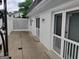 Side patio of the home features a privacy fence and access doors, creating a cozy outdoor space at 7640 Ryefield Dr, Sandy Springs, GA 30350