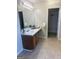 Bathroom features single sink vanity, large mirror, and walk-in closet at 2517 Walter Way, Stockbridge, GA 30281