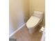 Bathroom features tile flooring and modern toilet with bidet at 2517 Walter Way, Stockbridge, GA 30281