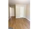 Bedroom with a door to the hallway, featuring wood-look floors and neutral paint at 2517 Walter Way, Stockbridge, GA 30281
