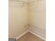 Walk-in closet features wire shelving and neutral walls at 2517 Walter Way, Stockbridge, GA 30281