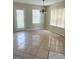 Open dining area with tile flooring, door to backyard and chandelier lighting at 2517 Walter Way, Stockbridge, GA 30281