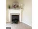 Cozy fireplace with decor, tile flooring, adding warmth and charm to the living space at 2517 Walter Way, Stockbridge, GA 30281