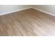 Close-up featuring the beautiful wood-look floors and white baseboards in the home at 2517 Walter Way, Stockbridge, GA 30281