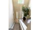 Bright foyer with tile flooring, large plant, and natural light from upper window at 2517 Walter Way, Stockbridge, GA 30281