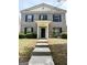 Charming two-story brick home featuring a welcoming entrance and well-maintained landscaping at 2517 Walter Way, Stockbridge, GA 30281