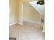 Hallway view of stairwell featuring tile flooring, and neutral wall color at 2517 Walter Way, Stockbridge, GA 30281