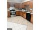 Well-lit kitchen features stainless steel appliances, tile backsplash, and plenty of cabinet space at 2517 Walter Way, Stockbridge, GA 30281