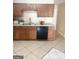 Cozy kitchen with tile floors and stainless steel appliances with spacious countertop at 2517 Walter Way, Stockbridge, GA 30281