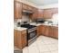 Well-equipped kitchen featuring warm wood cabinets, stainless steel appliances at 2517 Walter Way, Stockbridge, GA 30281