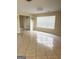 Open living room with tile flooring and a window, creating a bright space at 2517 Walter Way, Stockbridge, GA 30281