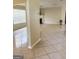 Spacious living area with tile flooring, connecting spaces, and natural light at 2517 Walter Way, Stockbridge, GA 30281