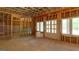Unfinished basement framed with windows and exterior door, ready for customization at 10765 Shallowford Rd, Roswell, GA 30075