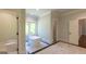 Luxurious bathroom featuring a soaking tub, shower, marble floors, and modern fixtures at 10765 Shallowford Rd, Roswell, GA 30075