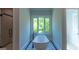 Modern bathroom featuring a sleek soaking tub next to a large window and glass shower at 10765 Shallowford Rd, Roswell, GA 30075