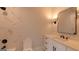 Elegant bathroom features tile and a white vanity with a decorative mirror at 10765 Shallowford Rd, Roswell, GA 30075