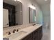 Bathroom with double sinks and black and white tile in the shower at 10765 Shallowford Rd, Roswell, GA 30075