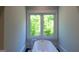 Bright bathroom featuring a standalone tub with a large window providing natural light at 10765 Shallowford Rd, Roswell, GA 30075