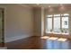 Bedroom with hardwood flooring, large window, and recessed lighting at 10765 Shallowford Rd, Roswell, GA 30075