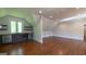 Bonus room featuring a wet bar with wine cooler, hardwood floors and recessed lighting at 10765 Shallowford Rd, Roswell, GA 30075