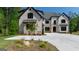 Beautiful home with a well-maintained lawn and landscaping, creating a welcoming and picturesque exterior at 10765 Shallowford Rd, Roswell, GA 30075