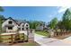 Street view of multiple luxury houses in a gated community with beautiful lawns and trees at 10765 Shallowford Rd, Roswell, GA 30075