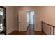 Hallway with hardwood floors and decorative front door at 10765 Shallowford Rd, Roswell, GA 30075