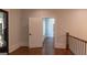 Hallway with hardwood floors and decorative front door at 10765 Shallowford Rd, Roswell, GA 30075