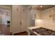 Bright kitchen boasts custom cabinetry, stainless steel appliances, and gas range at 10765 Shallowford Rd, Roswell, GA 30075