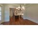Open-concept kitchen features a large island, stainless steel appliances and hardwood floors at 10765 Shallowford Rd, Roswell, GA 30075