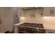 Modern kitchen with stainless steel oven, range, and pot filler at 10765 Shallowford Rd, Roswell, GA 30075
