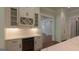 This wet bar includes custom cabinets, a wine rack and wine cooler at 10765 Shallowford Rd, Roswell, GA 30075